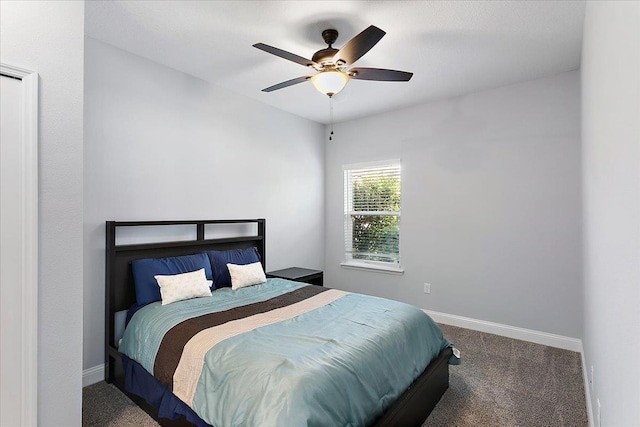 bedroom with carpet, baseboards, and ceiling fan