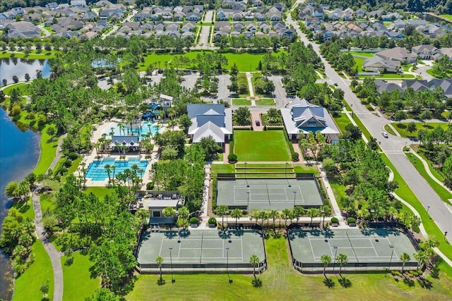 birds eye view of property with a residential view and a water view