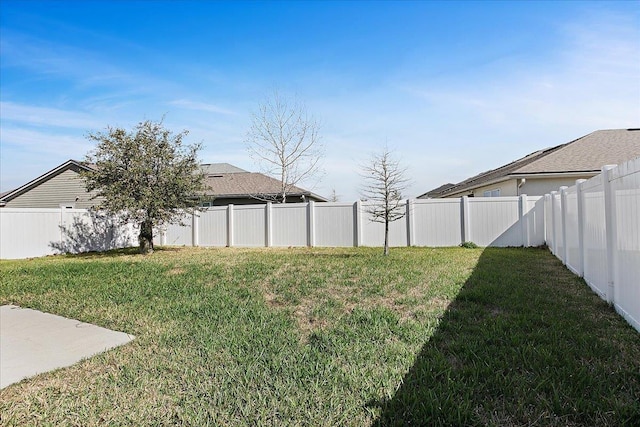 view of yard featuring a fenced backyard