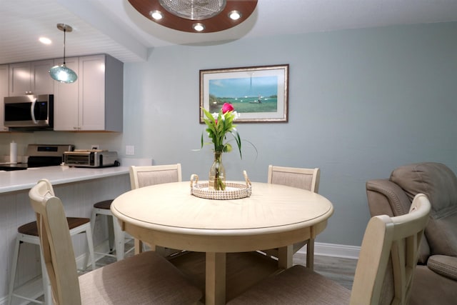 5 N Ocean Palm Villas Unit 5, Flagler Beach, FL 32136 - dining area featuring wood finished floors, baseboards, and recessed lighting