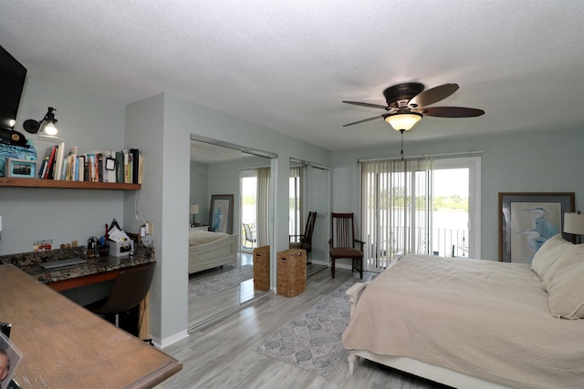 5 N Ocean Palm Villas Unit 5, Flagler Beach, FL 32136 - bedroom with light wood-style flooring, access to exterior, and a ceiling fan