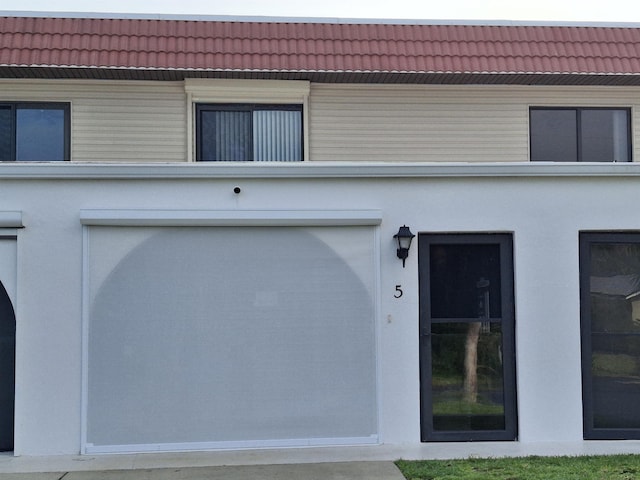 5 N Ocean Palm Villas Unit 5, Flagler Beach, FL 32136 - entrance to property featuring a tile roof