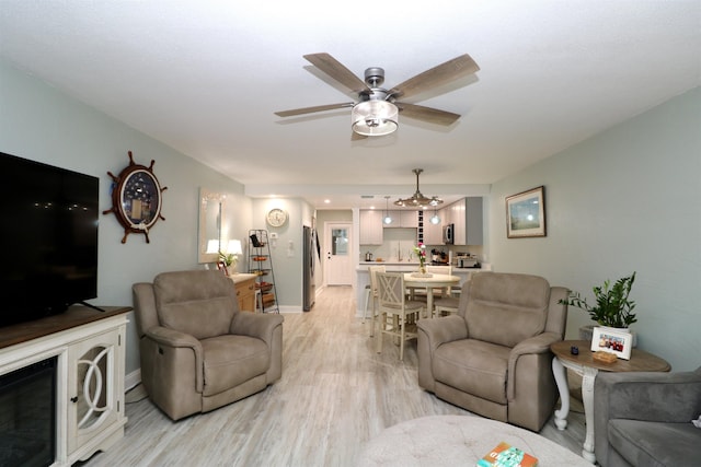 5 N Ocean Palm Villas Unit 5, Flagler Beach, FL 32136 - living area with light wood-type flooring, a ceiling fan, and baseboards