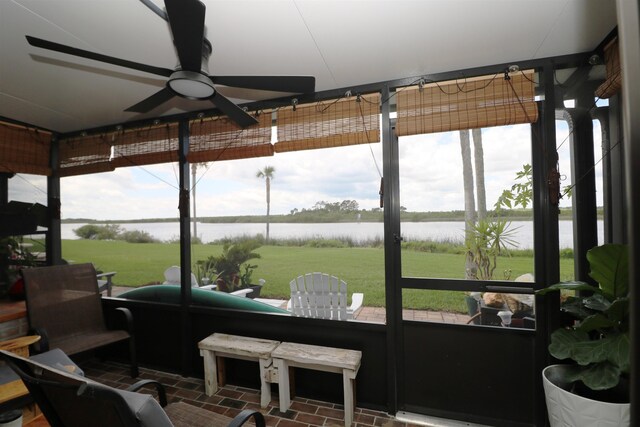 5 N Ocean Palm Villas Unit 5, Flagler Beach, FL 32136 - sunroom / solarium featuring ceiling fan, a water view, and plenty of natural light