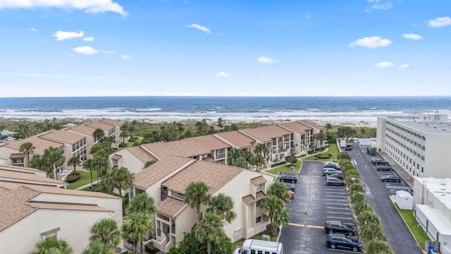 bird's eye view with a water view and a view of the beach