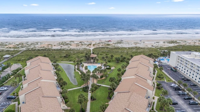 aerial view featuring a view of the beach and a water view