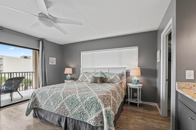 bedroom with dark wood-type flooring, ceiling fan, and multiple windows