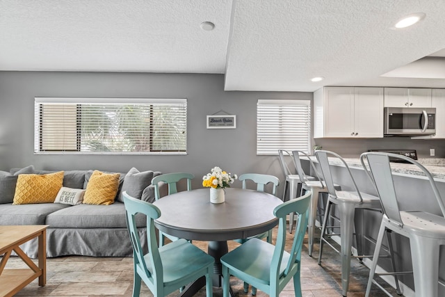 850 A1A Beach Blvd Unit 3, Saint Augustine Beach, FL 32080 - dining room with a textured ceiling and recessed lighting