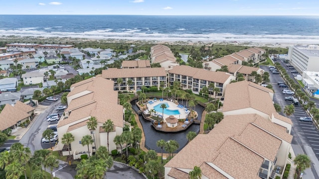 aerial view featuring a water view and a beach view