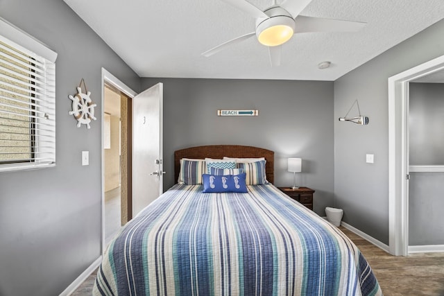 bedroom featuring ceiling fan and wood-type flooring