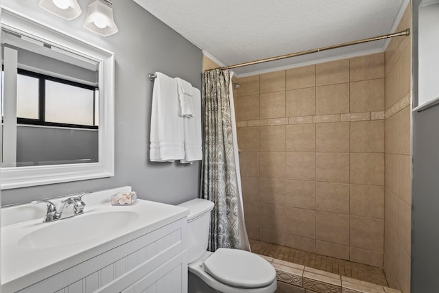 850 A1A Beach Blvd Unit 3, Saint Augustine Beach, FL 32080 - bathroom featuring a tile shower, vanity, and a textured ceiling