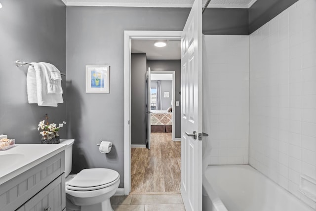 full bathroom with toilet, vanity, tile patterned flooring, and shower / tub combination