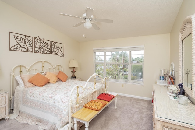 carpeted bedroom with lofted ceiling and ceiling fan