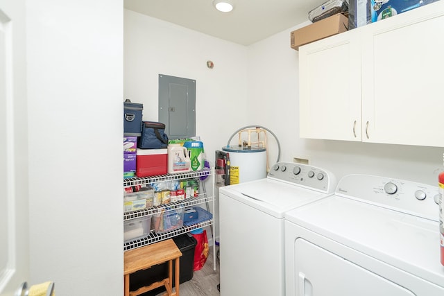 laundry area with gas water heater, wood-type flooring, cabinets, electric panel, and washer and clothes dryer