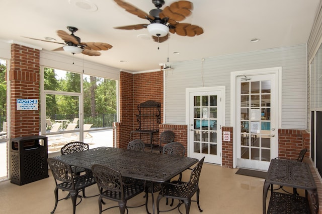 sunroom / solarium featuring ceiling fan