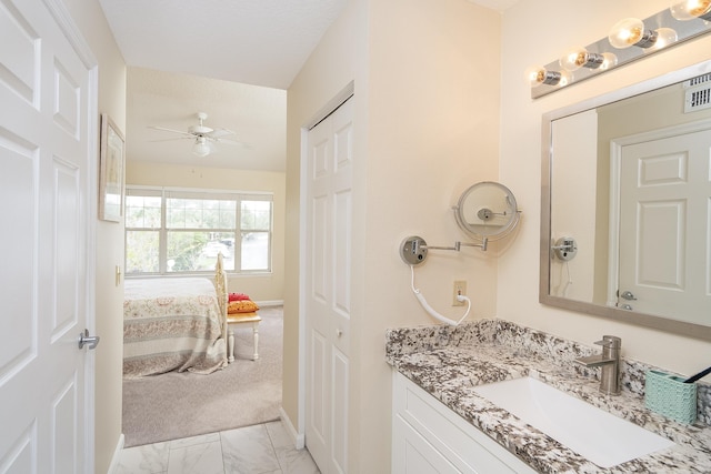 bathroom featuring vanity and ceiling fan