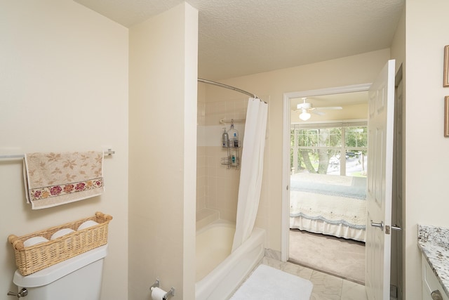 bathroom featuring toilet, ceiling fan, shower / tub combo with curtain, and a textured ceiling