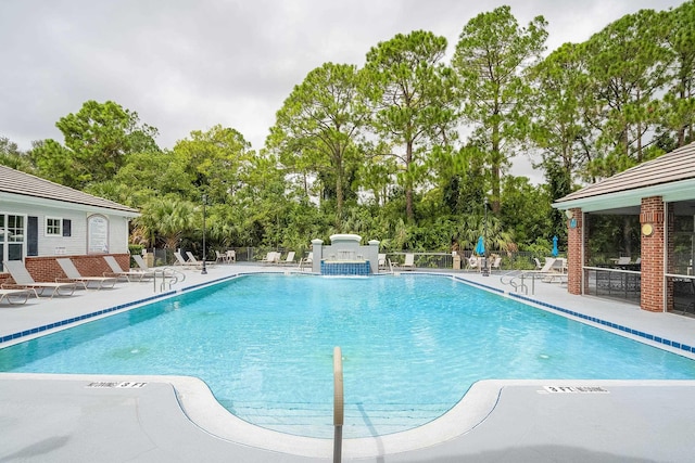 view of swimming pool featuring a patio area