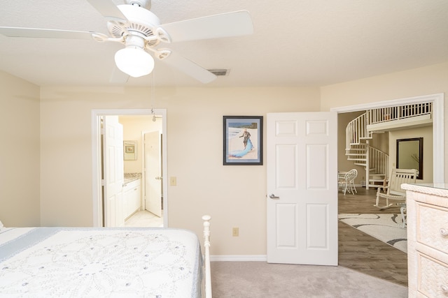 unfurnished bedroom featuring light colored carpet and ceiling fan