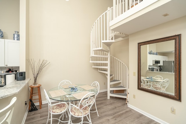 dining space featuring light hardwood / wood-style floors