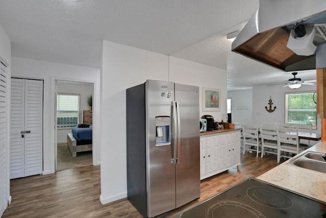 237 Riberia St, Saint Augustine, FL 32084 - kitchen featuring dark wood finished floors, stainless steel refrigerator with ice dispenser, white cabinetry, and a wealth of natural light