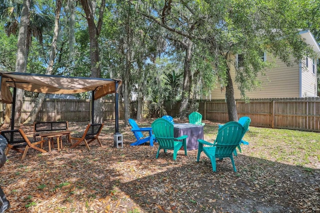 237 Riberia St, Saint Augustine, FL 32084 - view of yard with a fenced backyard and an outdoor fire pit