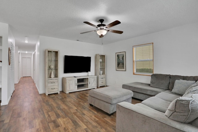 237 Riberia St, Saint Augustine, FL 32084 - living area with dark wood-type flooring, a ceiling fan, a textured ceiling, and visible vents