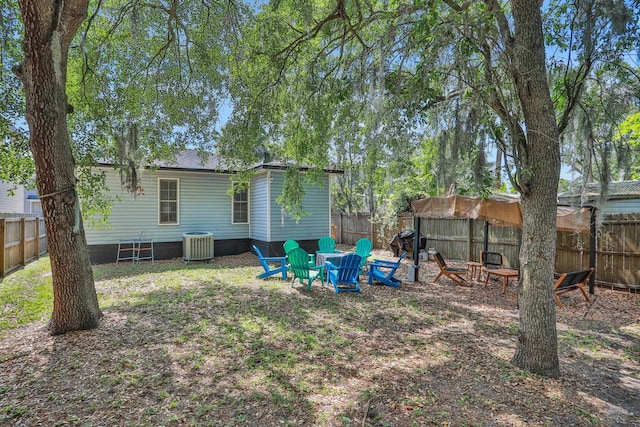 237 Riberia St, Saint Augustine, FL 32084 - view of yard with a fenced backyard, a fire pit, and cooling unit