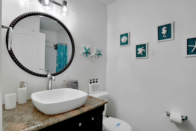 237 Riberia St, Saint Augustine, FL 32084 - full bathroom with vanity, curtained shower, and toilet