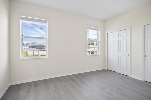 unfurnished bedroom featuring light wood-type flooring