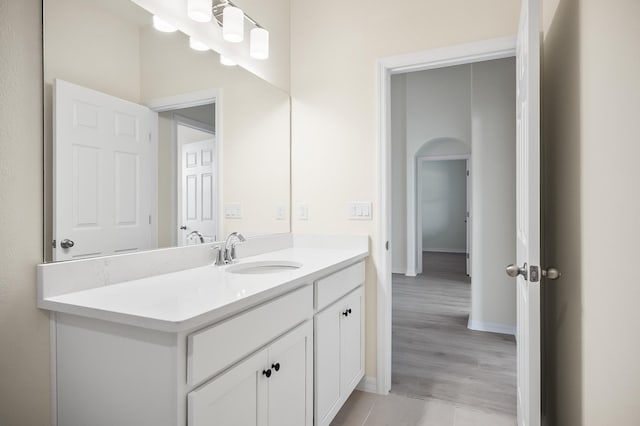 bathroom featuring vanity and hardwood / wood-style flooring