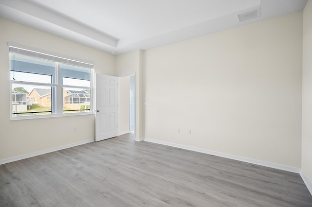 spare room featuring light hardwood / wood-style flooring