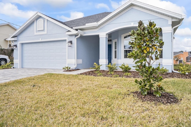 ranch-style home featuring a front lawn and a garage