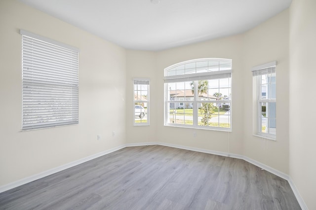 spare room with light wood-type flooring