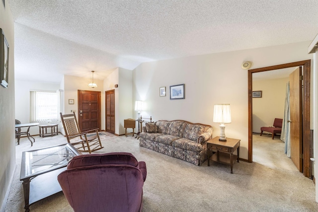 carpeted living room featuring a textured ceiling and lofted ceiling