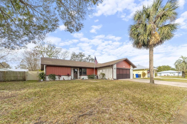 ranch-style house with a front yard and a garage