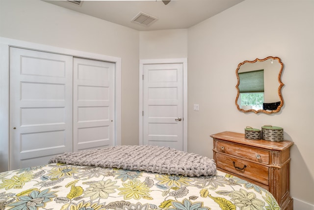 bedroom with ceiling fan and a closet