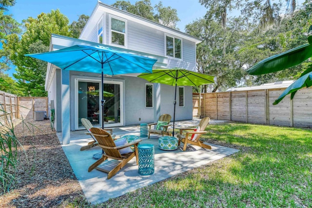 rear view of house with a yard