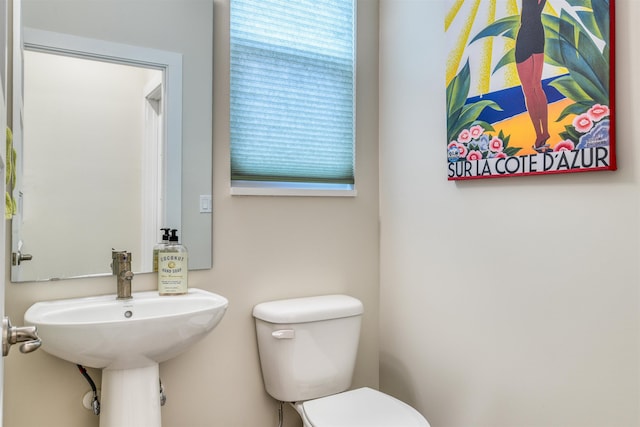 bathroom with toilet and sink