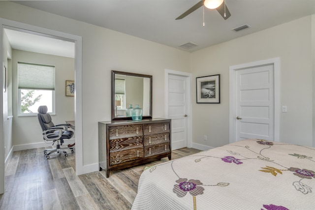 bedroom featuring light wood-type flooring and ceiling fan