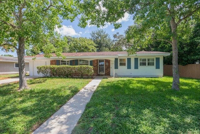 ranch-style home with a front lawn