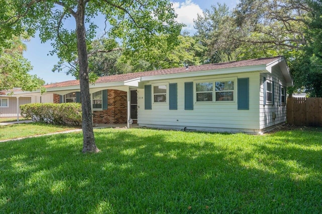 ranch-style house with a front yard