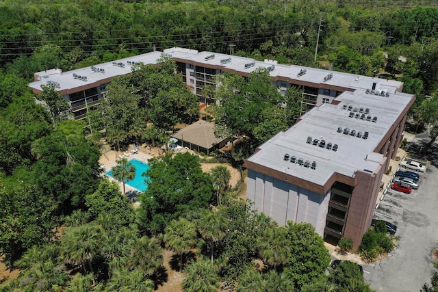 640 N Nova Rd Unit 117, Ormond Beach, FL 32174 - view of subject property featuring a forest and a pool