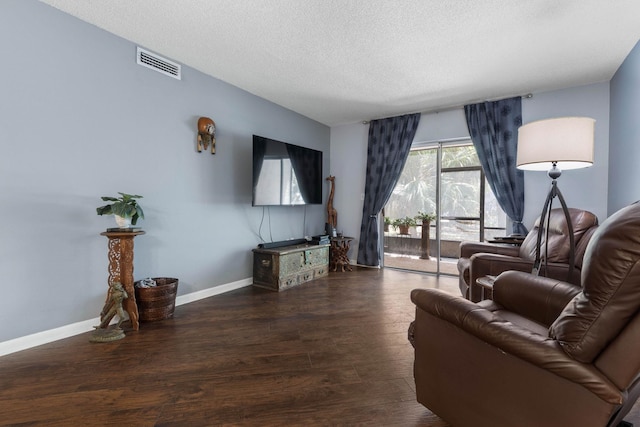 640 N Nova Rd Unit 117, Ormond Beach, FL 32174 - living room featuring wood finished floors and a textured ceiling