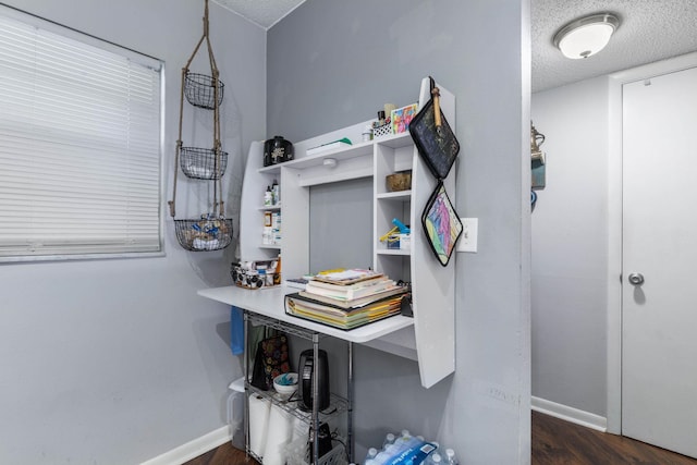 640 N Nova Rd Unit 117, Ormond Beach, FL 32174 - office area featuring a textured ceiling and dark wood-style floors