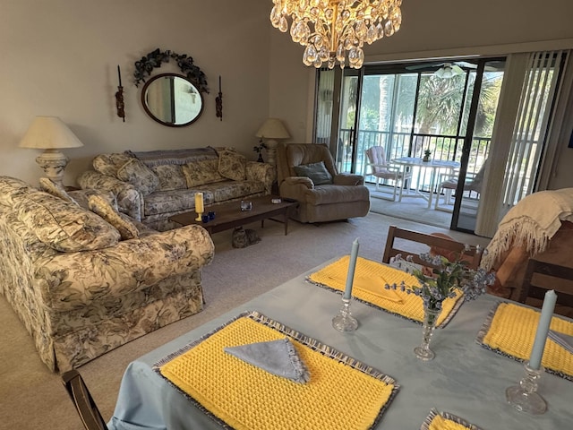 living room with an inviting chandelier and carpet flooring