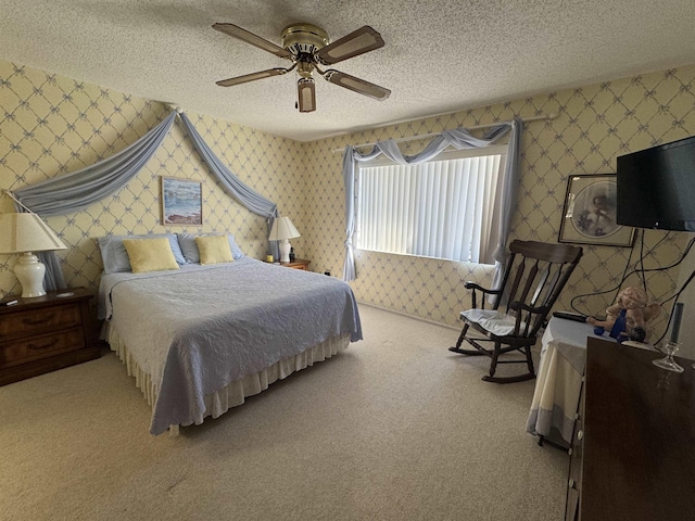 carpeted bedroom with wallpapered walls and a textured ceiling