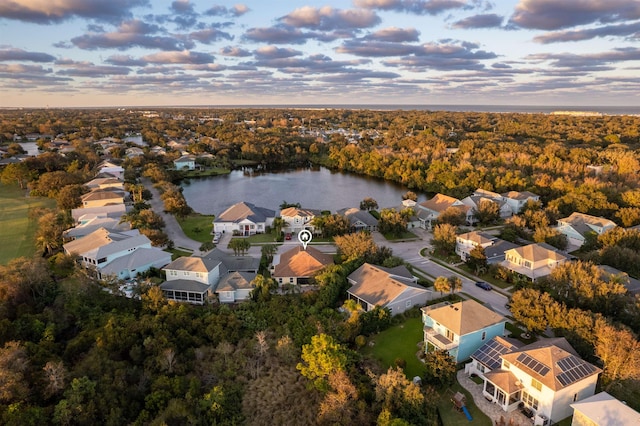 aerial view at dusk with a water view