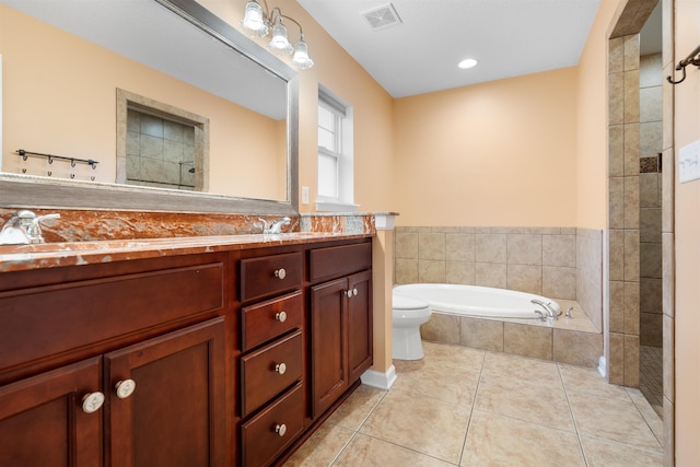 full bathroom with tile patterned floors, vanity, toilet, and shower with separate bathtub