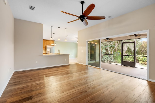 unfurnished living room featuring wood-type flooring